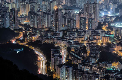 High angle view of illuminated city buildings at night