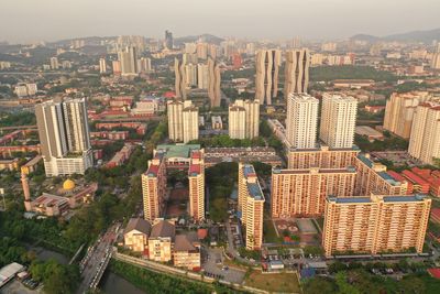 High angle view of buildings in city against sky