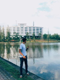 Full length of woman standing in lake