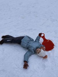 Low section of man standing on snow