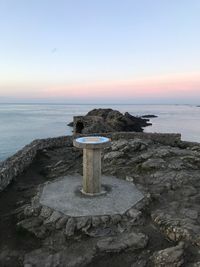 Scenic view of sea against sky at sunset