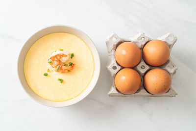 High angle view of eggs in container on table