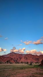 View of desert against cloudy sky