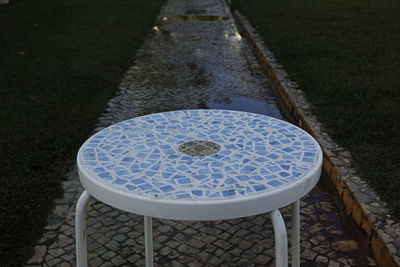 High angle view of empty chairs and table in park