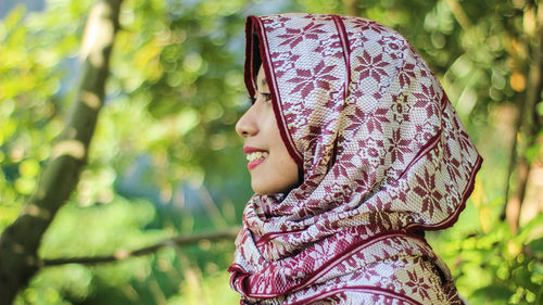 Close-up of smiling woman in hijab