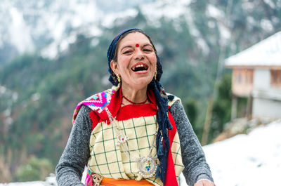 Portrait of a smiling young woman in winter