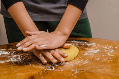 Kneading the dough for sweet biscuits with the help of hands