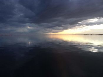 Scenic view of sea against sky at sunset