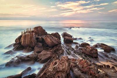 Scenic view of sea against sky during sunset