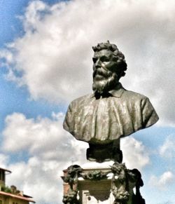 Low angle view of statue against cloudy sky