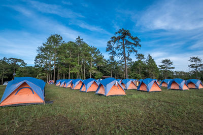 Tent on field against sky