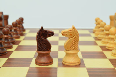 Close-up of chess against white background