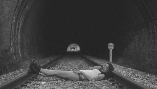 Portrait of young woman lying on floor