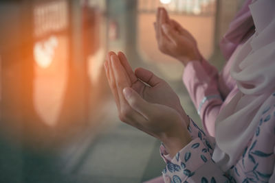 Close-up of hands holding text