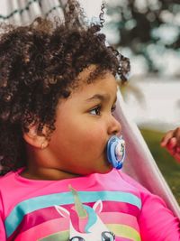 Close-up portrait of a girl looking away