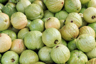 Full frame shot of guavas for sale at market stall