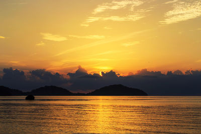 Scenic view of sea against romantic sky at sunset