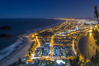 High angle view of illuminated city at night