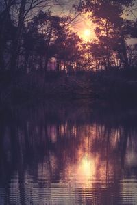 Scenic view of lake at sunset