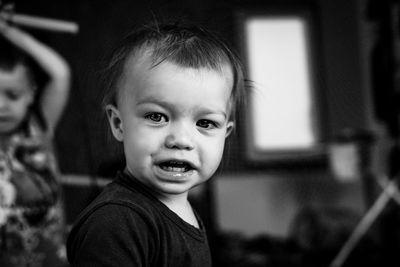 Close-up portrait of cute girl at home