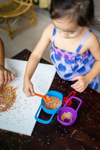 Playing with the colourful sugar sprinkles. fun activites for children. fine motor skills.