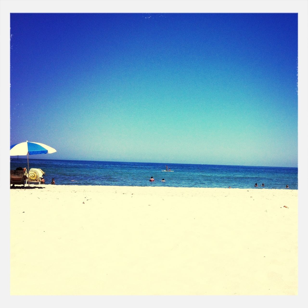 sea, horizon over water, beach, water, blue, transfer print, clear sky, copy space, sand, tranquil scene, tranquility, shore, auto post production filter, scenics, beauty in nature, nature, incidental people, vacations, idyllic, panoramic