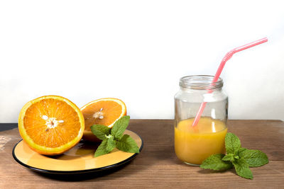 Close-up of drink in glass jar on table