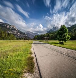 Scenic view of landscape against cloudy sky