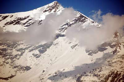 Scenic view of mountains against sky during winter