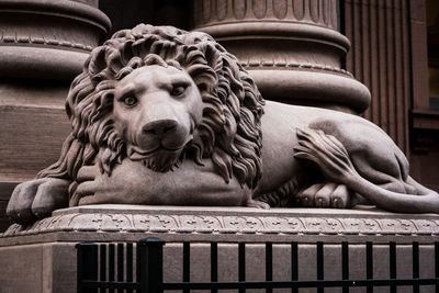 Lion statue outside dollar savings bank
