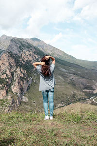 Young woman looking at mountains