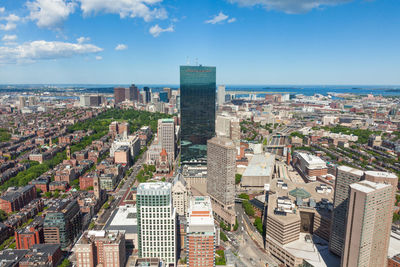 High angle view of buildings in city against sky