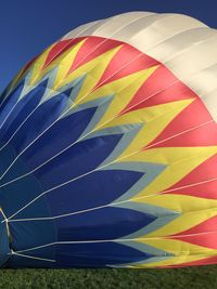 Close-up of hot air balloon against blue sky