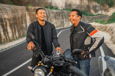 Man riding motorcycle on road