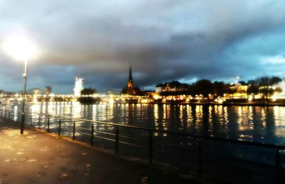 Illuminated city at waterfront