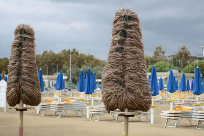 Close-up of beach against blue sky