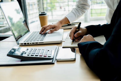 Man using laptop on table