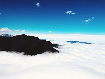 View of mountain range against cloudy sky