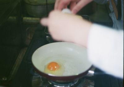 Close-up of person preparing food in kitchen