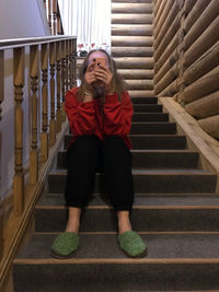 Portrait of woman on staircase