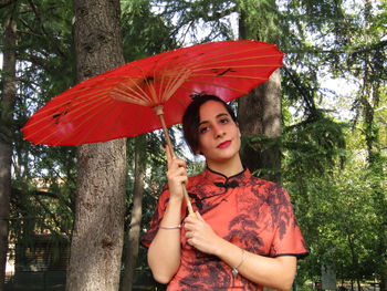 Portrait of a beautiful young woman in rain
