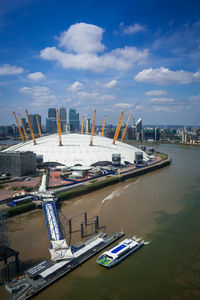 High angle view of harbor by buildings against sky