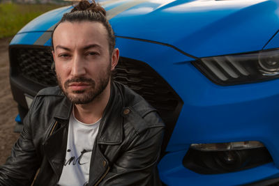 Portrait of young man in car