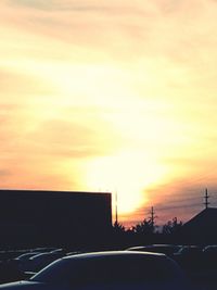 Cars on road at sunset