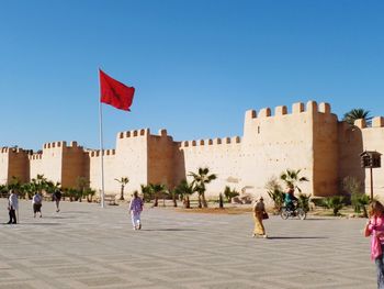 View of flags against clear sky