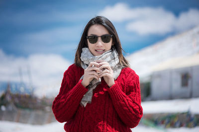 Portrait of young woman wearing sunglasses