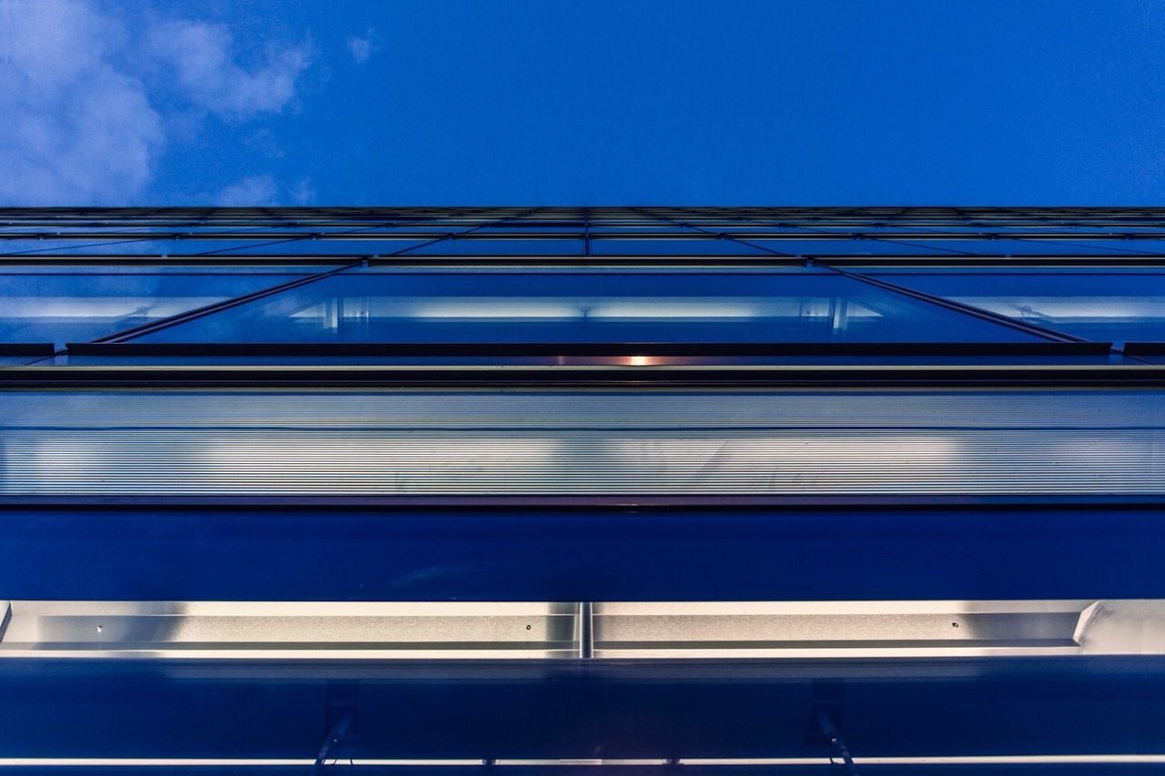 architecture, built structure, blue, building exterior, low angle view, modern, sky, building, window, glass - material, clear sky, city, no people, office building, day, reflection, outdoors, railing, glass, sunlight
