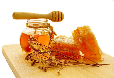 Close-up of orange on table against white background