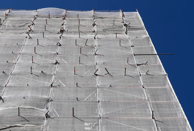 Low angle view of building against clear blue sky