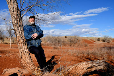 Young man standing on mountain